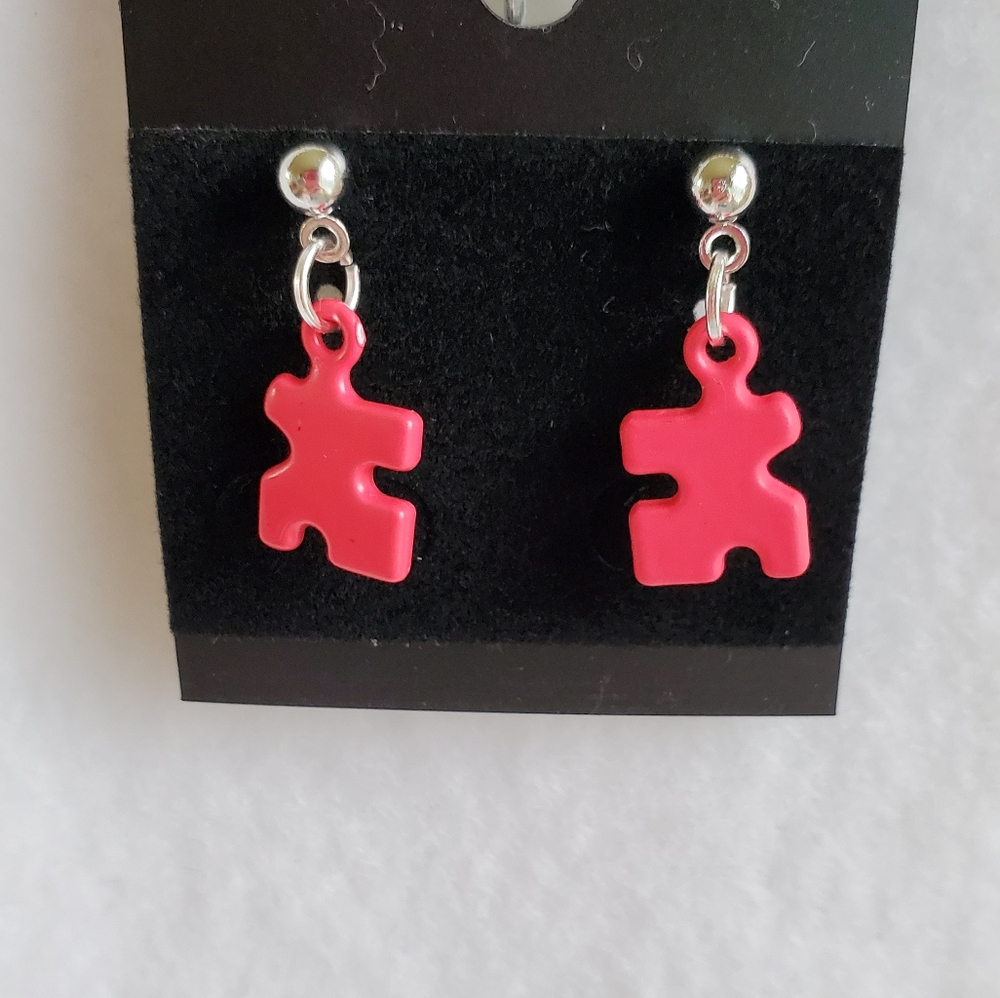 Womens hot pink puzzle piece post earrings